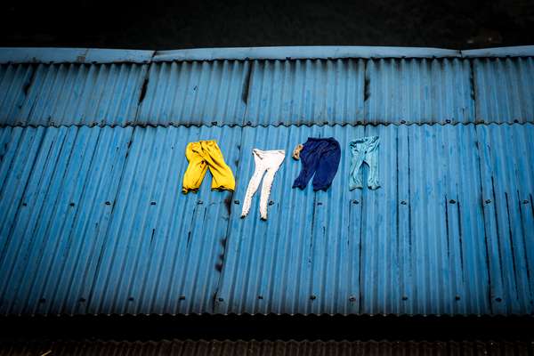 Washing dries on a roof, Nepal